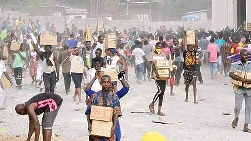 Breaking News: A group of Abuja residents have broken into a warehouse owned by the National Emergency Management Agency (NEMA) and have looted food items.