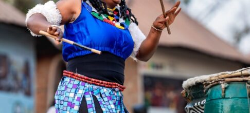colorful nigerian drummer performing at festival