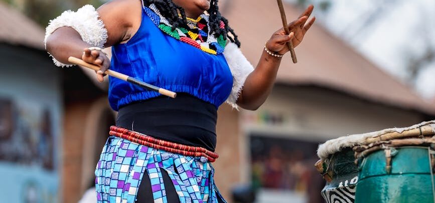 colorful nigerian drummer performing at festival